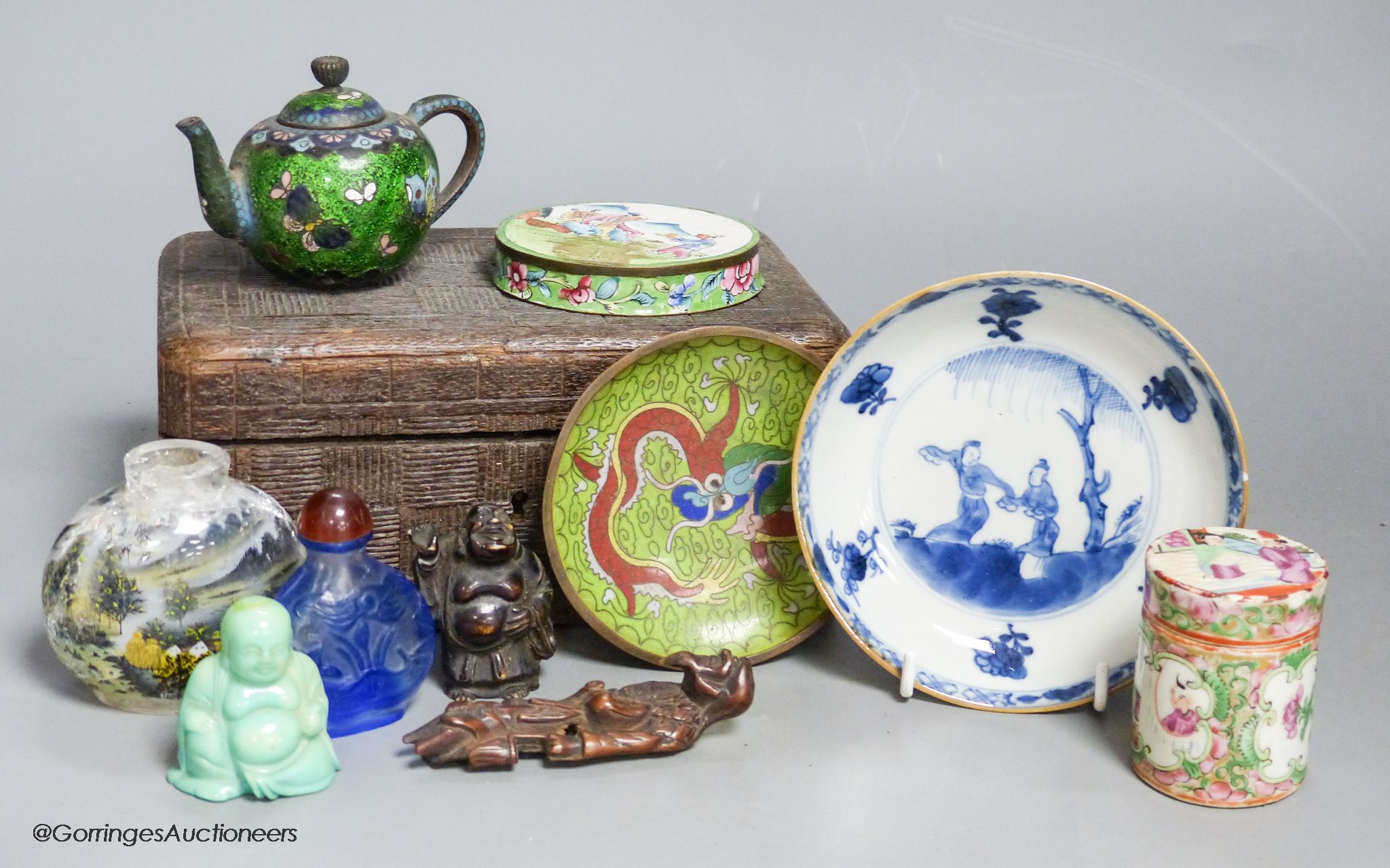 A small miscellaneous Oriental collection including enamel snuff boxes, Buddha carvings etc.